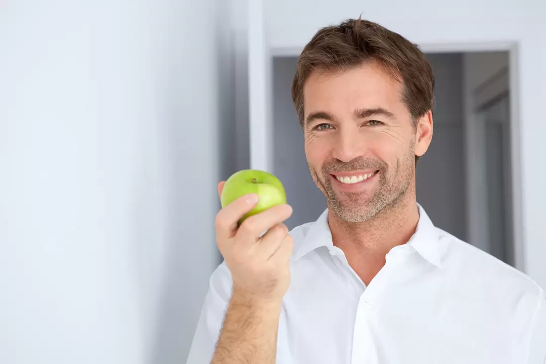 a man eats an apple for potency